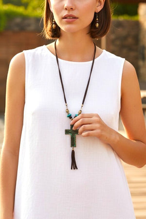 HAMMERED CROSS ACCENT FAUX SUEDE TASSEL CORD NECKLACE AND BEAD DANGLE EARRING SET