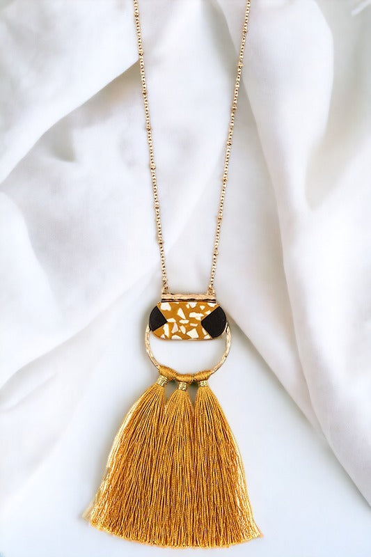 Elongated Round Pendant Tassel Necklace