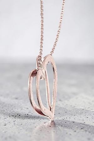 ELONGATED HEART PENDANT NECKLACE AND HEART DANGLE EARRING SET
