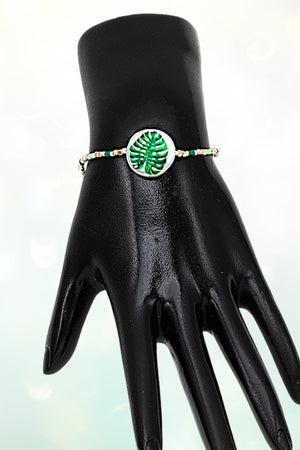 FLOWER IMPRINTED BUTTON ACCENT CUBIC BEAD STRETCH BRACELET